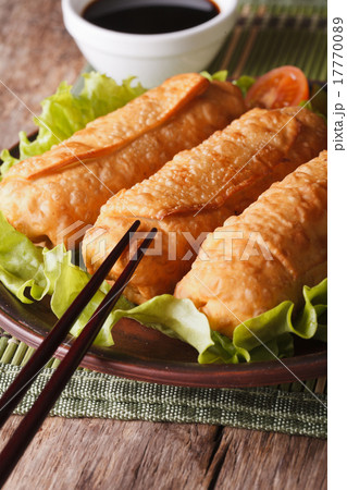 fried spring rolls on a plate and chopsticks fried spring rolls on a plate and chopsticks 17770089
