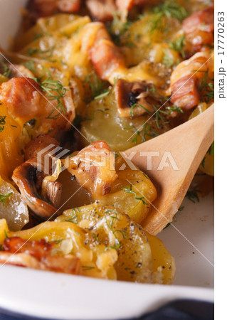 Baked potatoes with meat in the gratin dish macro 17770263