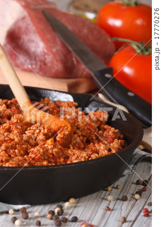 Bolognese sauce in a frying pan close-up vertical Bolognese sauce in a frying pan close-up vertical 17770276