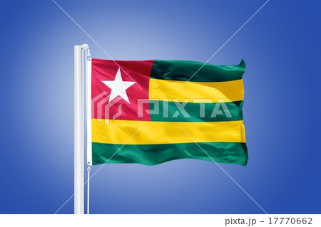 Flag of Togo flying against a blue sky Flag of Togo flying against a blue sky 17770662