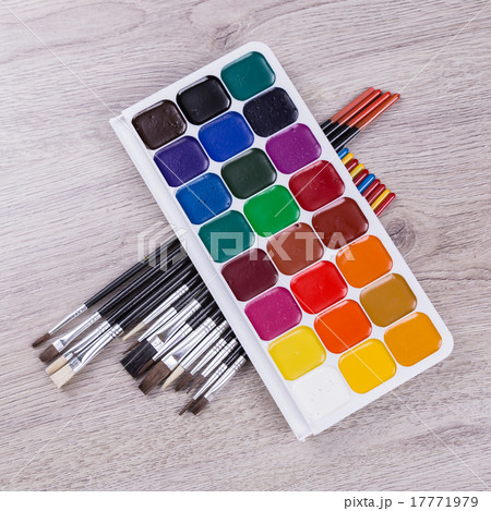 Watercolor paints with brushes on wood Watercolor paints with brushes on wood 17771979