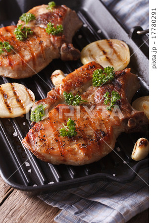 Two grilled pork steak in a pan grill close-up 17780291
