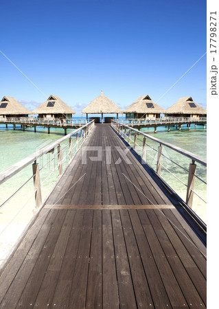 wooden road over the sea to traditional lodges on  17798271
