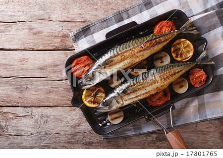 Grilled mackerel in pan with vegetables top view 17801765