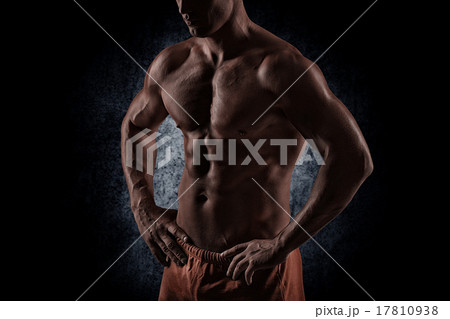 strong athletic man on black background 17810938
