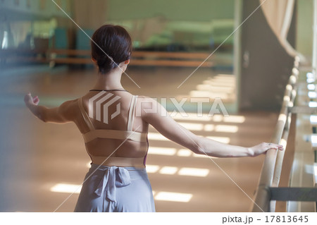 classic ballet dancer posing at barre on rehearsal classic ballet dancer posing at barre on rehearsal 17813645