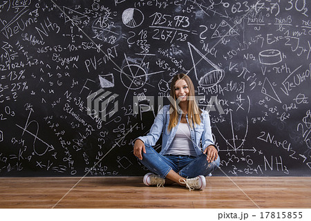 Beautiful young girl in front of blackboard Beautiful young girl in front of blackboard 17815855
