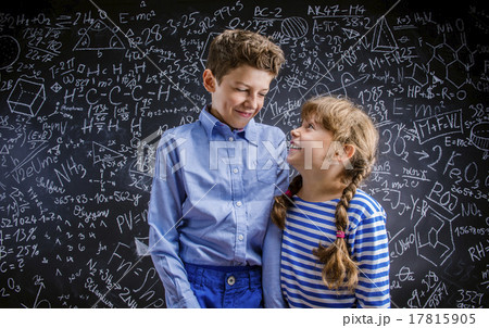 Cute little boy and girl in front of a big 17815905