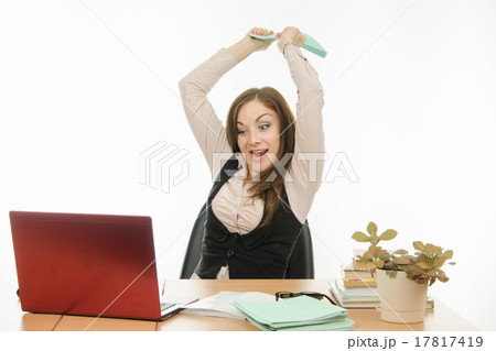 The teacher has a book on a laptop The teacher has a book on a laptop 17817419