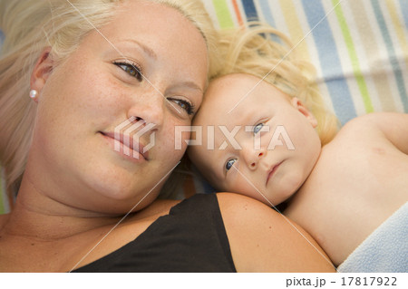 Cute Baby Boy Laying Next to His Mommy on Blanket 17817922