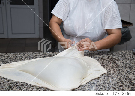 female hands kneading dough and making banitsa female hands kneading dough and making banitsa 17818266