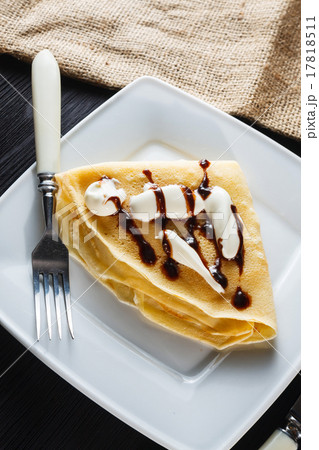 Sweet pancake with chocolate sauce and yogurt Sweet pancake with chocolate sauce and yogurt 17818511