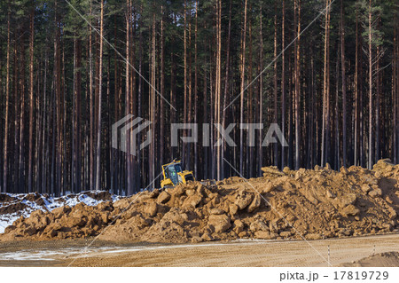 Yellow excavator at work Yellow excavator at work 17819729