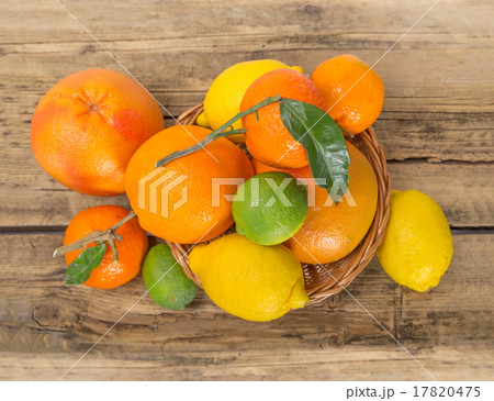 Citrus fruits on wooden background Citrus fruits on wooden background 17820475