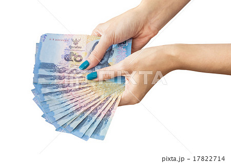 Thai Banknote money in female hand, isolated on white background 17822714