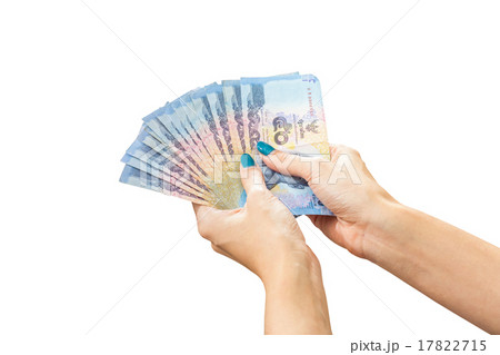 Thai Banknote money in female hand, isolated on white background 17822715
