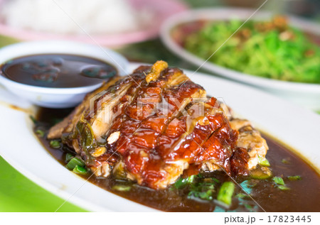 Roasted duck with sauce and green noodle in the plate, Chinese f 17823445