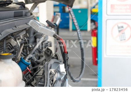 Gas nozzle to add gas in car at gas station 17823456