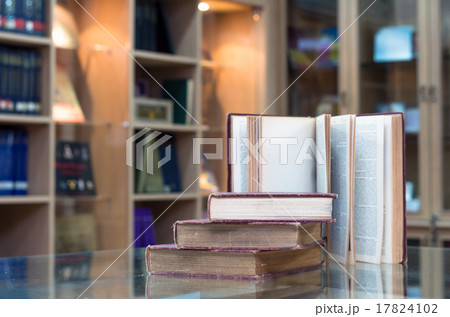 old book on the glass desk in library old book on the glass desk in library 17824102