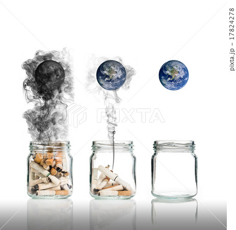 Cigarette butt in bottle with smoke Burning the world, world no 17824278