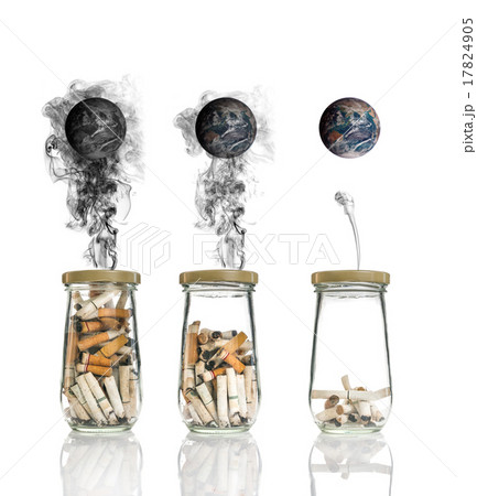 Cigarette butt in bottle with smoke Burning the world, world no 17824905
