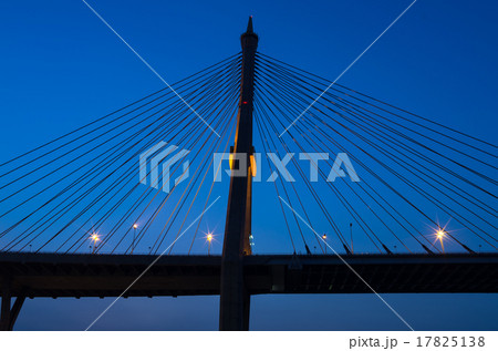 silhouette of Fragment of a cable stayed bridge at twilight time silhouette of Fragment of a cable stayed bridge at twilight time 17825138