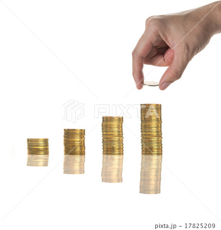 Hand holding and adding a golden coin on the stacks of golden co Hand holding and adding a golden coin on the stacks of golden co 17825209