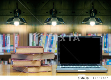 old book on the desk in library with laptop and Luxury lighting old book on the desk in library with laptop and Luxury lighting 17825387