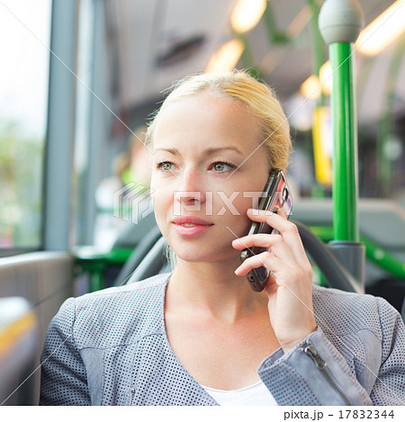 Blonde business woman traveling by bus. 17832344