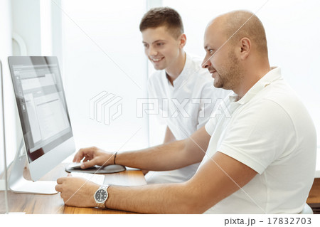 Dentist and assistant viewing the patient's card 17832703