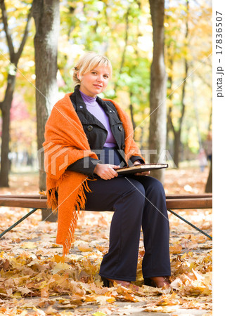 pregnant woman in autumn park pregnant woman in autumn park 17836507