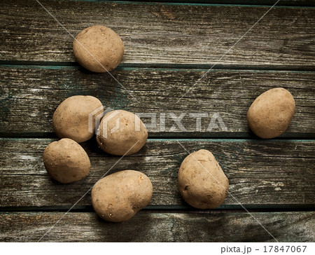 Potatoes on wooden board Potatoes on wooden board 17847067