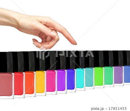 Group of bright nail polishes and woman hand Group of bright nail polishes and woman hand 17851455