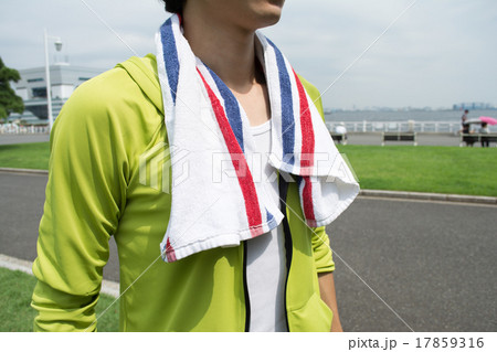Young Asian man using a towel after exercise 17859316