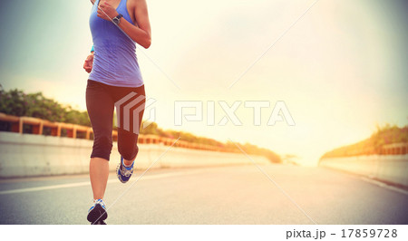 young woman runner running on city bridge road 17859728