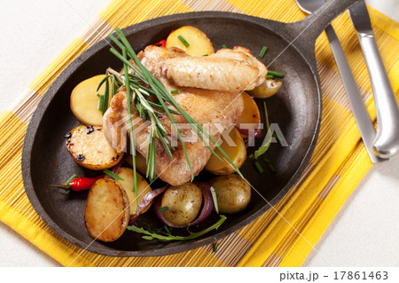 Roasted chicken wings and potatoes 17861463