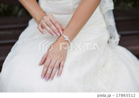 Wedding gloves on hands of bride, close-up 17863512
