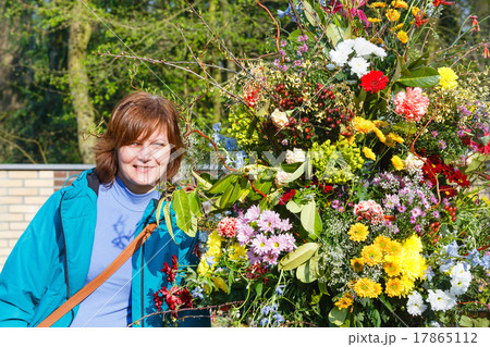Woman near big spring bouquet. 17865112