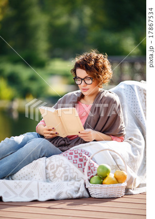 Pleasant girl reading book  17867534