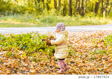 Little girl with yellow leaf. Little girl with yellow leaf. 17867924