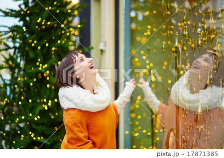 Young girl looking at Parisian shop-windows Young girl looking at Parisian shop-windows 17871385