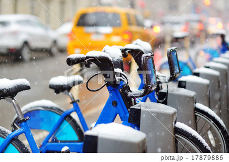 Rental city bikes covered with snow in New York 17879886