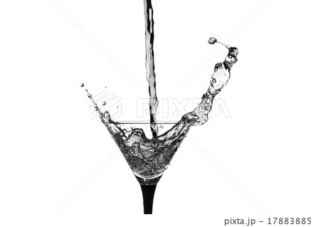 Cocktail glass with splashes on white background. 17883885