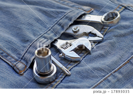 several tools in workers pocket jeans several tools in workers pocket jeans 17893035