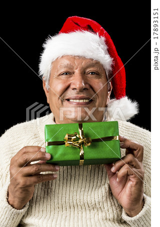 Smiling Old Man Handing Over A Wrapped Green Gift Smiling Old Man Handing Over A Wrapped Green Gift 17893151