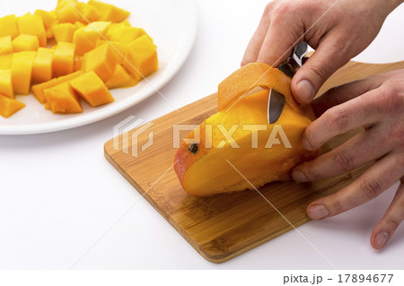 Peeling The Mango Slice Containing The Fruit Pit 17894677