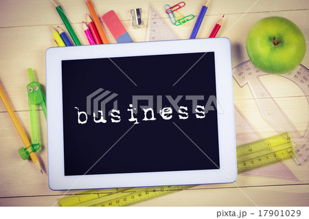 Business against students table with school supplies Business against students table with school supplies 17901029
