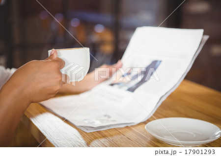 Casual businesswoman looking at files Casual businesswoman looking at files 17901293