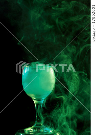 Green smoke in the glass. Halloween. 17902001