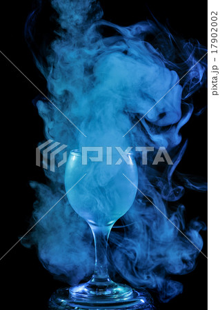 Aquamarine smoke in a glass. Halloween. 17902002